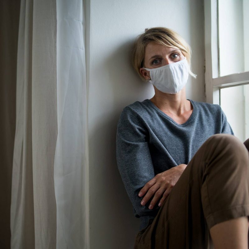woman indoors at home feeling stressed mental health and coronavirus concept
